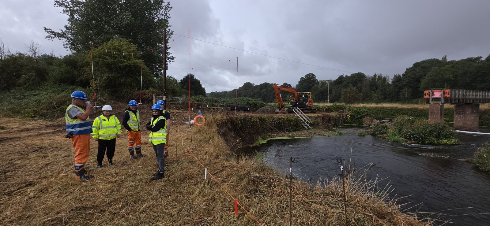 Bridge team beside the river and civil engineering works at Dotton