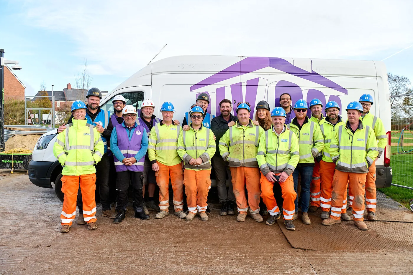 Bridge colleagues and the DIY SOS team gathered beside the DIY SOS van